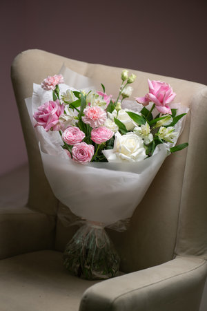 Delicate composition of white and pink roses in a basketの写真素材