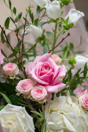 Delicate composition of white and pink flowers in vertical format. Close upの写真素材