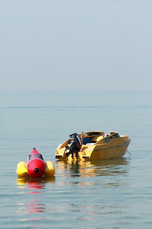 Banana Boat in the seaの写真素材