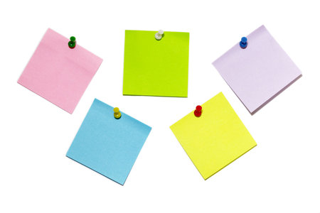 Five colored sticker notes with push-pins isolated over white backgroundの写真素材