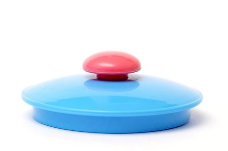 Plastic toy tea-pot lid isolated over white background macro shotの写真素材