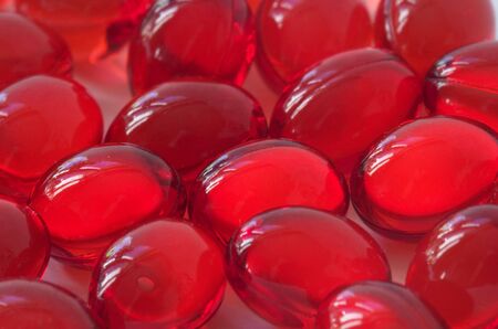 Red glossy transparent vitamin E pillsの写真素材