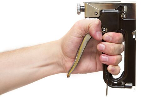 Professional staple gun in the hand isolated over white backgroundの写真素材