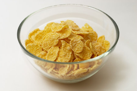 Small portion of cornflakes in the little glass bowl