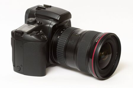 DSLR camera with wide-angle lens isolated over white backgroundの写真素材
