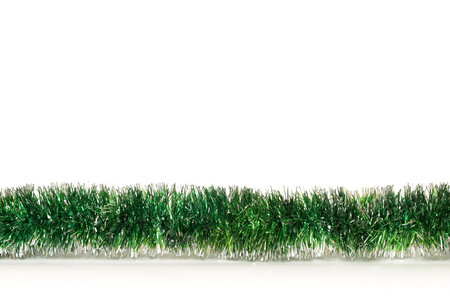 Green Happy New Year tinsel fragment over white backgroundの写真素材