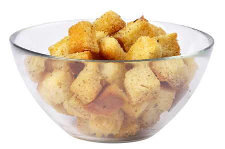 Small portion of croutons in the little glass bowl isolated over white backgroundの写真素材