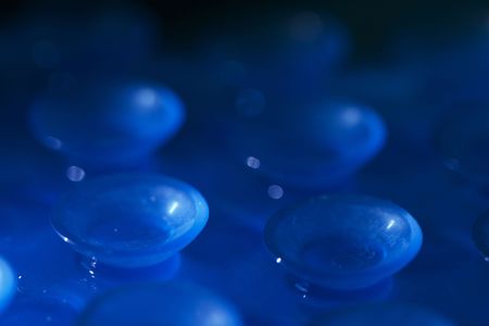 Blue plastic sucker background macro shot (shallow depth of field)の写真素材