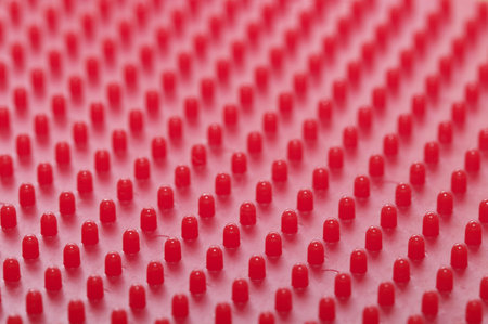 Red plastic pattern background macro shot (blurred background)