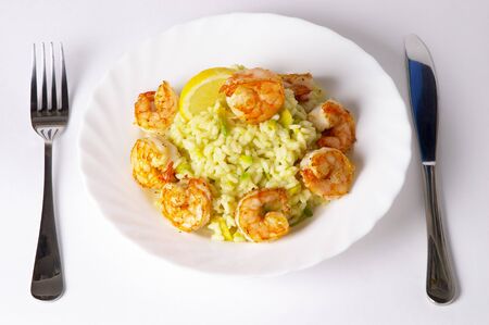 Risotto with fried prawns and avocado macro shot backgroundの写真素材