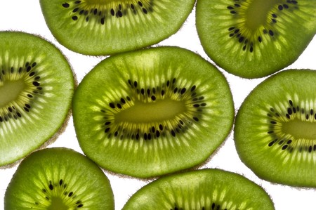 Sliced kiwi with backlight macro shot backgroundの写真素材
