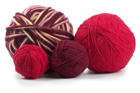 Four colored wool clews stack isolated over white backgroundの写真素材