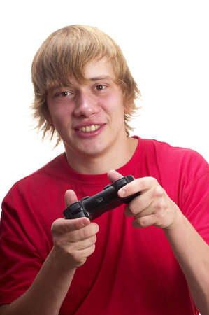 Young teenage boy gamer with gamepad in the hands isolated over white background