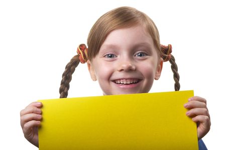 Little funny girl with yellow sheet of paper in the hands isolated over white backgroundの写真素材