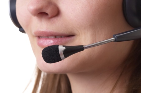 Friendly call center operator girl face fragment isolated over white backgroundの写真素材