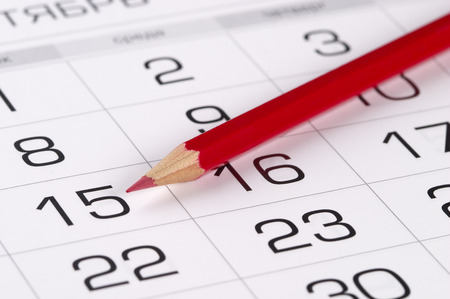 Red pencil over slightly defocused calendar backgroundの写真素材
