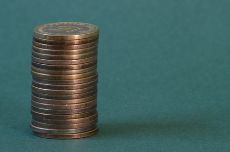 stack of Croatian Lipa coins on green background