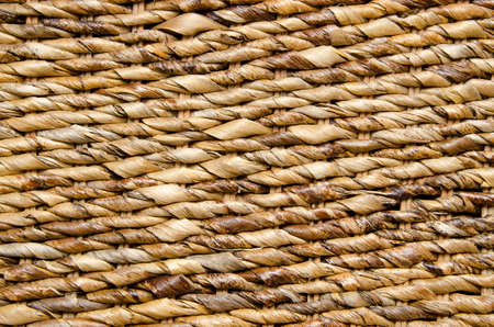 old brown knitted straw furniture detail textured の写真素材