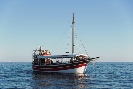 Porec, Croatia - Circa 2016: Tourist ship taking people sightseeing off the coast of Porec, Croatia. A spot on the tourist ship can be acquired in most bigger towns along the Croatian coastlineのeditorial素材