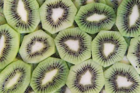 green slices of kiwi fruit texture backgroundの写真素材