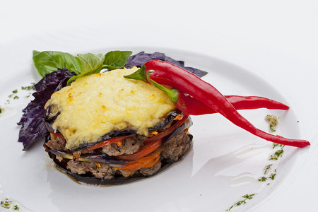 Moussaka of lamb on a white plateの写真素材