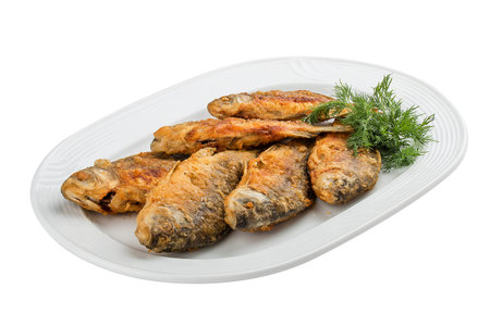 Fried carp on a white plateの写真素材