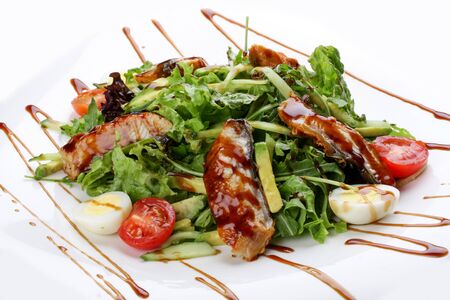 Salad with smoked eel on white backgroundの写真素材