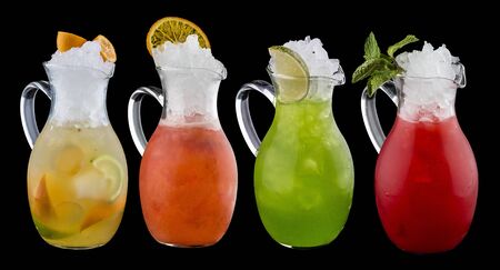 Set of colorful lemonades in jugs. On dark backgroundの写真素材