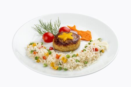 Children's menu. Fish cutlet with rice and vegetables. On white backgroundの写真素材