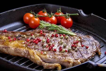 Cowboy beef steak in a cast iron pan の写真素材