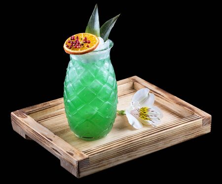 Refreshing citrus cocktail in a glass on a wooden Board. Dark background.の写真素材