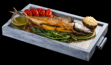 Smoked mackerel with potatoes baked with suluguni cheese and baked tomatoes