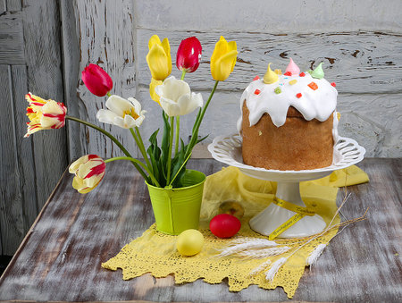 Easter cake kulich. Traditional Easter sweet bread decorated meringue and  candy cane shape eggs on...