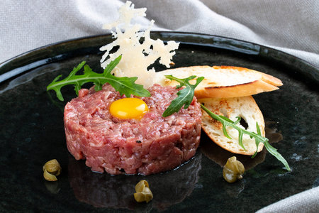 Tuna Tartar on a black plateの写真素材