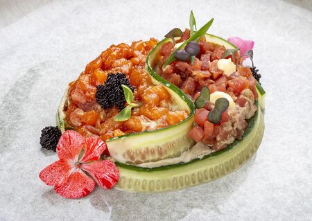 Salmon and tuna tartar with tobiko caviar.の写真素材