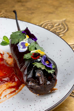 Julienne with white mushrooms and veal, in the eggplant. Classic retro Russian dishの写真素材