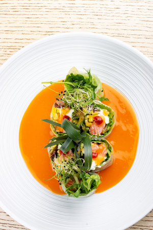 Salmon roll with Philadelphia cheese and pickled pumpkin, in rice paper with daikon and Ponzu sauce....