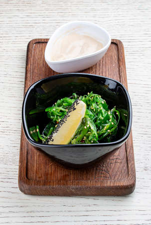 Chuka salad with walnut sauce. Vegetable dishの写真素材