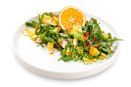 Juicy salad with arugula, orange and avocado. On a light background.の写真素材