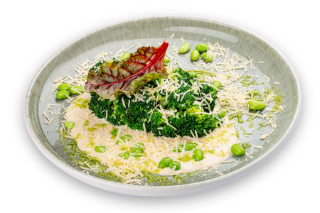 Steamed broccolli with white sauce and beans. Isolated image on a white background.の写真素材