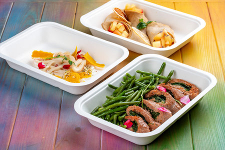 Colorful and nutritious meal kits prepared in eco-friendly containers for a convenient and healthy on-the-go meal.の写真素材