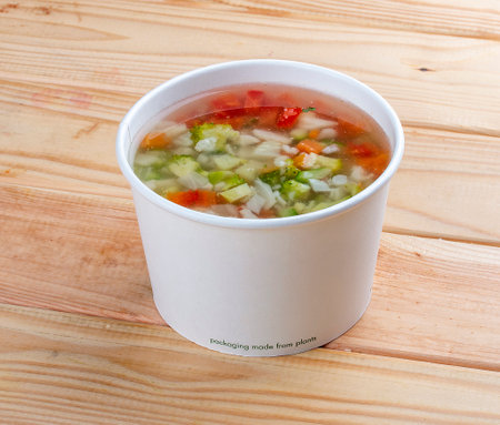 Ministerone - vegetable soup. Healthy food. Takeaway food. On a wooden background.の写真素材