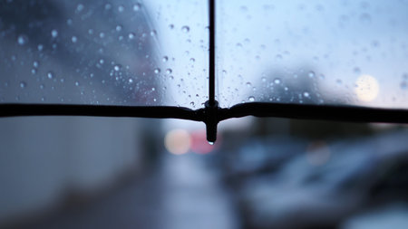 Rain drops on the car window. Shallow depth of field.の写真素材
