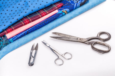 Colored buttons and cloth on white backgroundの写真素材