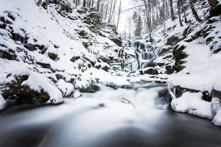 Mountain waterfall at winter. Carpathian mountains, Ukraineの写真素材