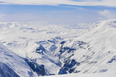Panoramic view at snowy mountains