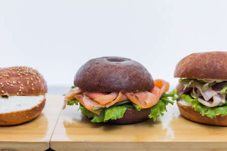 Burgers on wooden plankの写真素材