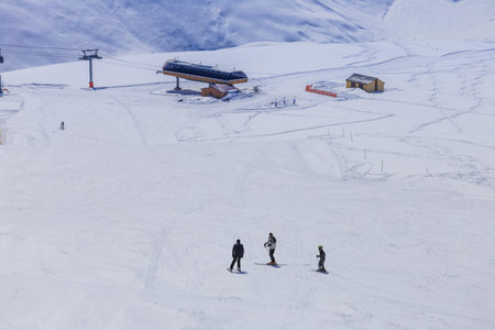 Man sliding down on snowy hill