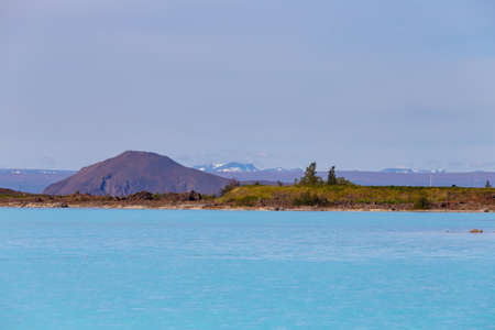 Hverir geothermal area in the north of Iceland near Lake Myvatn, with geothermal lake, looking like Blue Lagoon, Hot Mud Pots and great landscape in the Geothermal Area Hverir, summer day.の写真素材