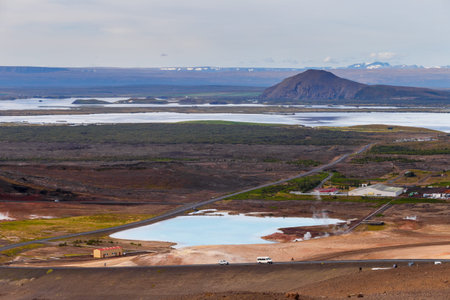 Hverir geothermal area in the north of Iceland near Lake Myvatn, with geothermal lake, looking like Blue Lagoon, Hot Mud Pots and great landscape in the Geothermal Area Hverir, summer day.の写真素材